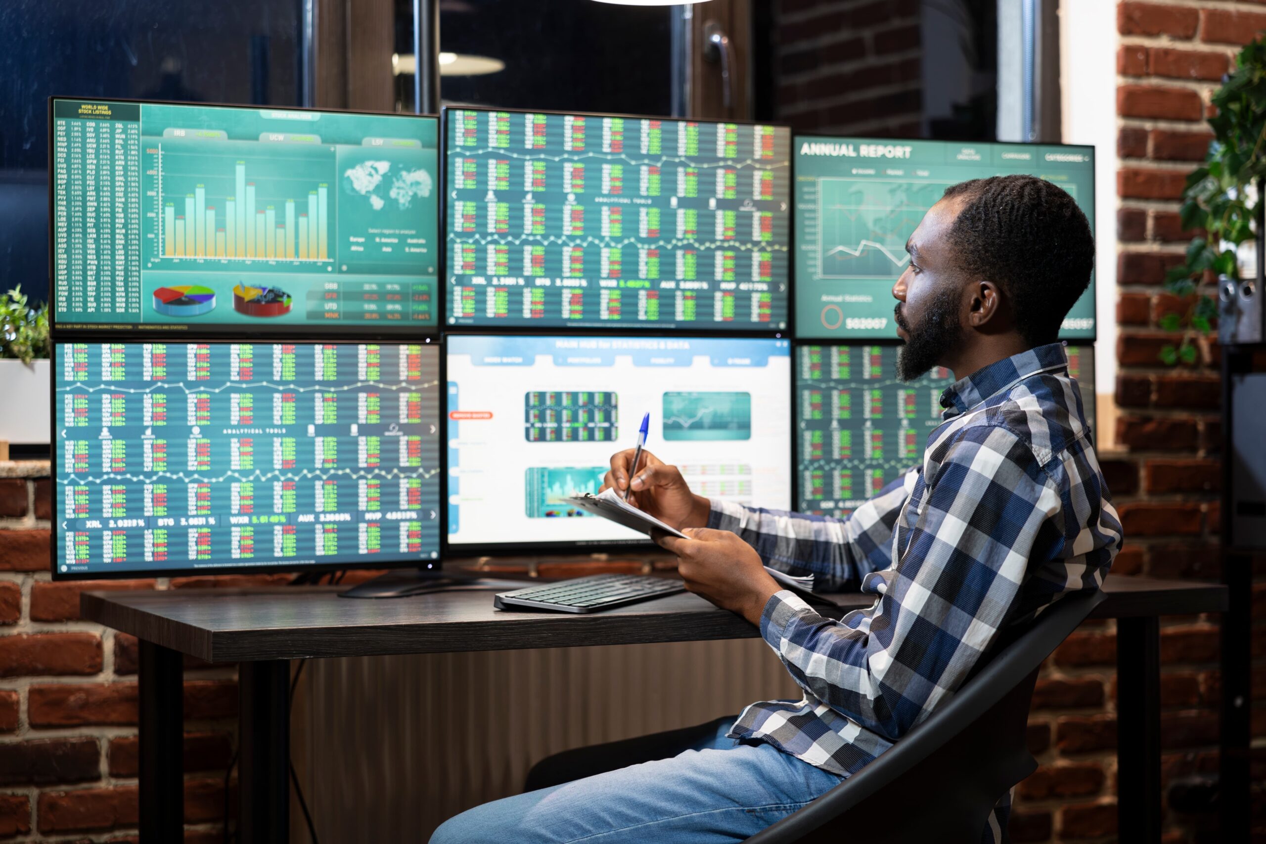 digital marketing team analyzing campaign data on multiple screens