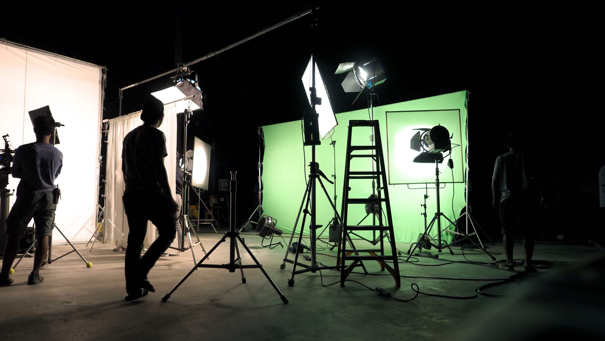 film crew preparing camera equipment on commercial shoot set