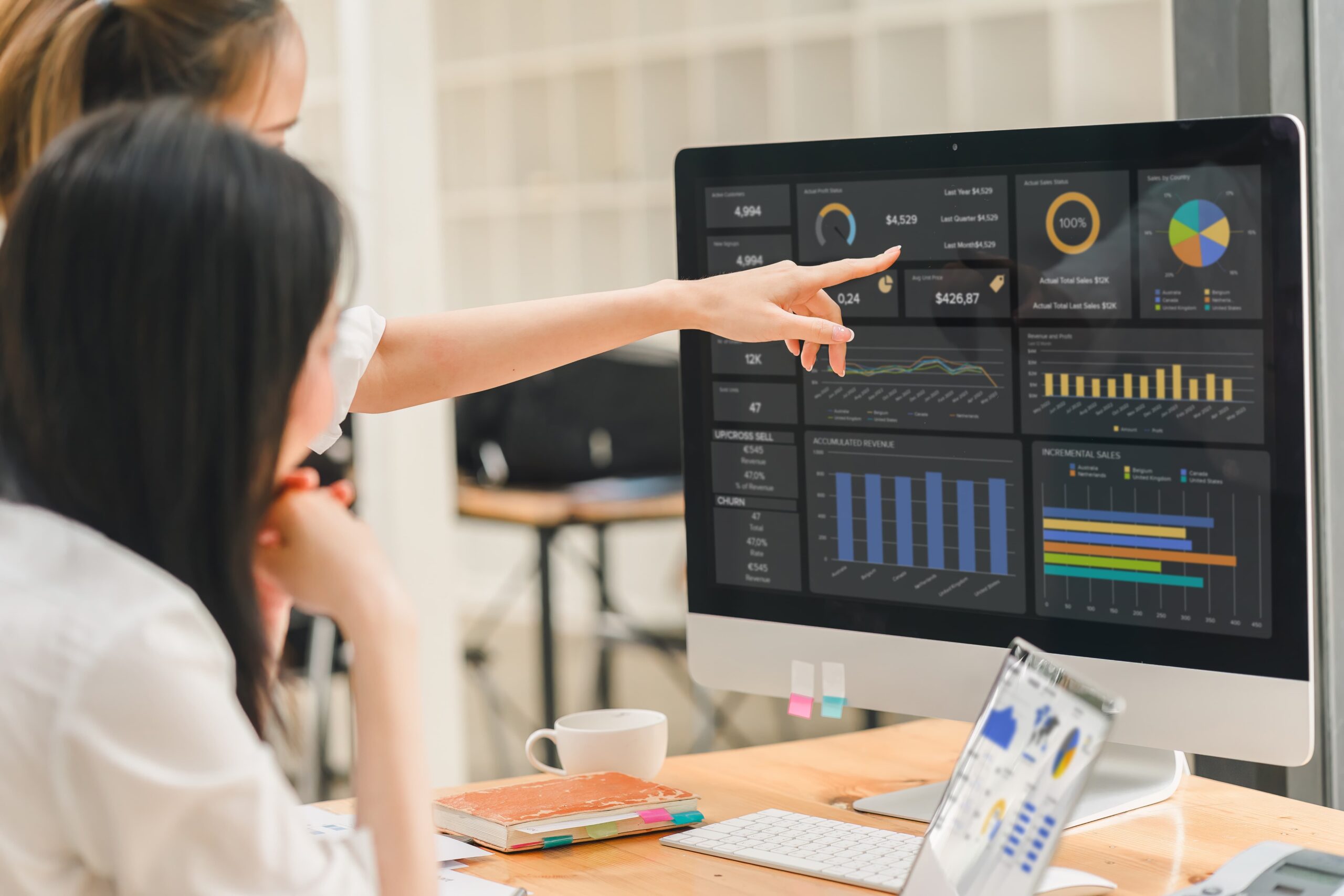 When to update your content strategy shown by team reviewing marketing analytics