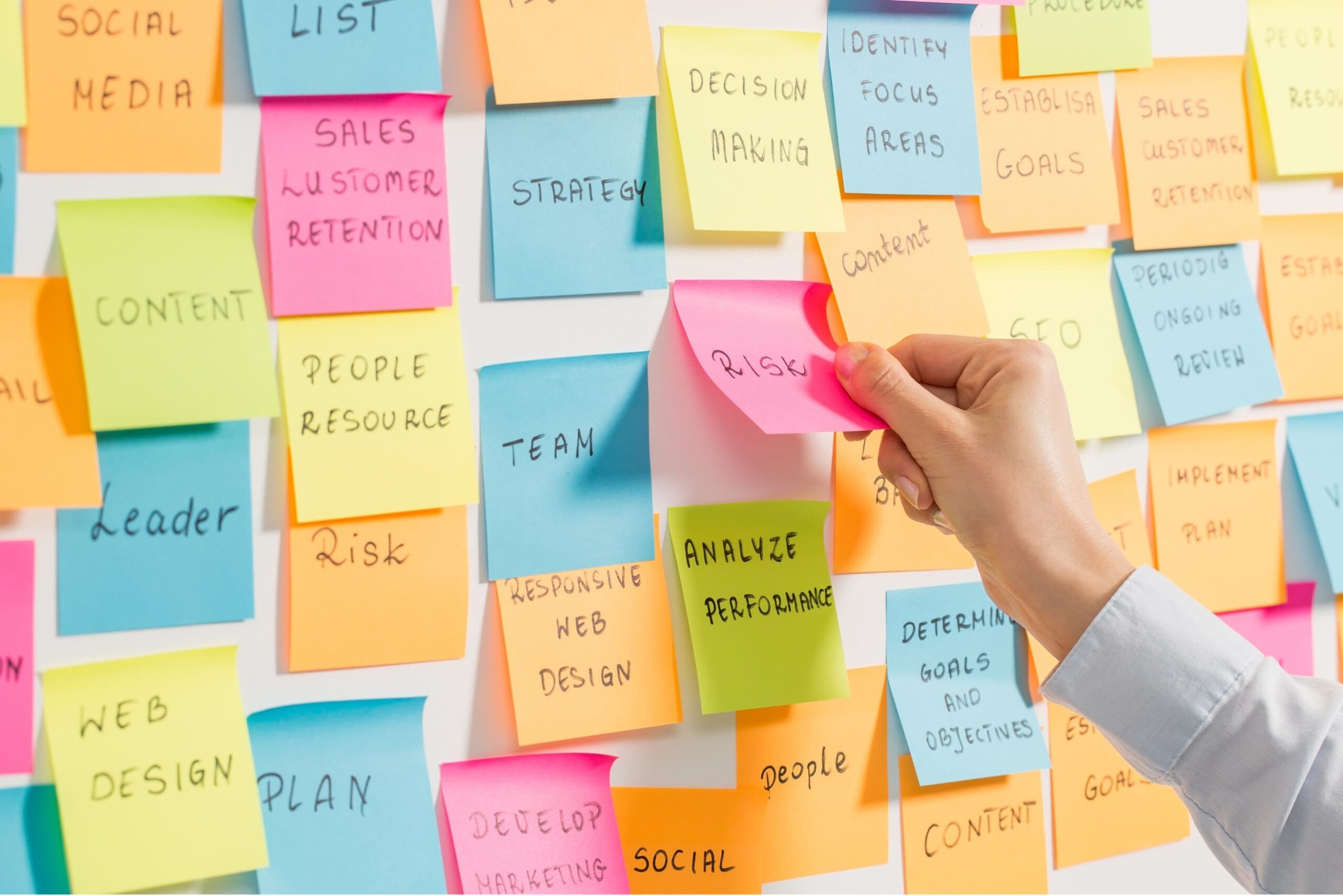 Modern content calendar on a whiteboard with post-it notes and tasks