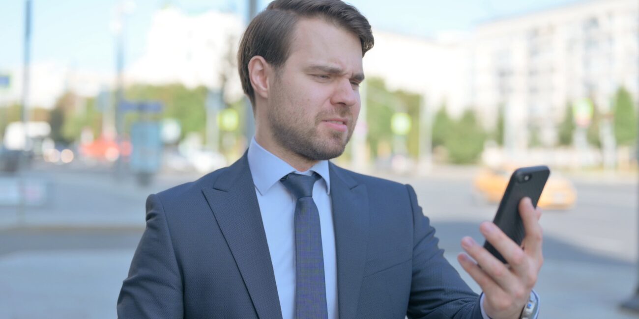 Person frustrated by a poor mobile website experience in 2026