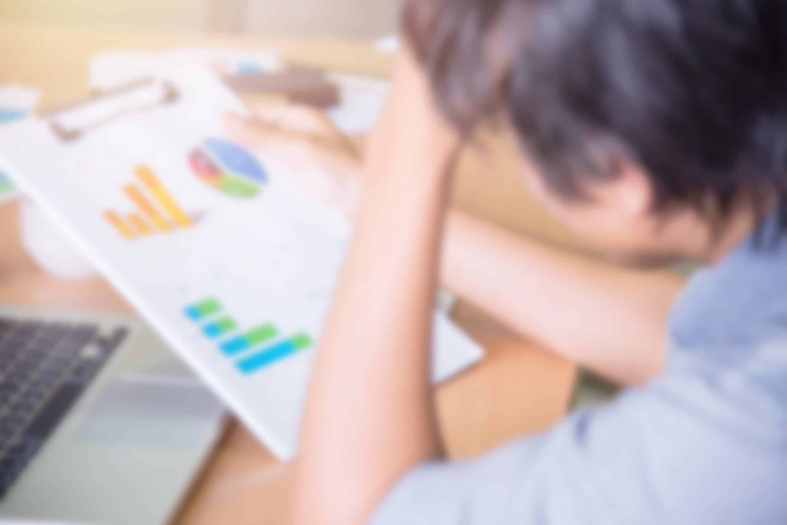 Business owner reviewing Google Ads dashboard concerned about wasting money on ads