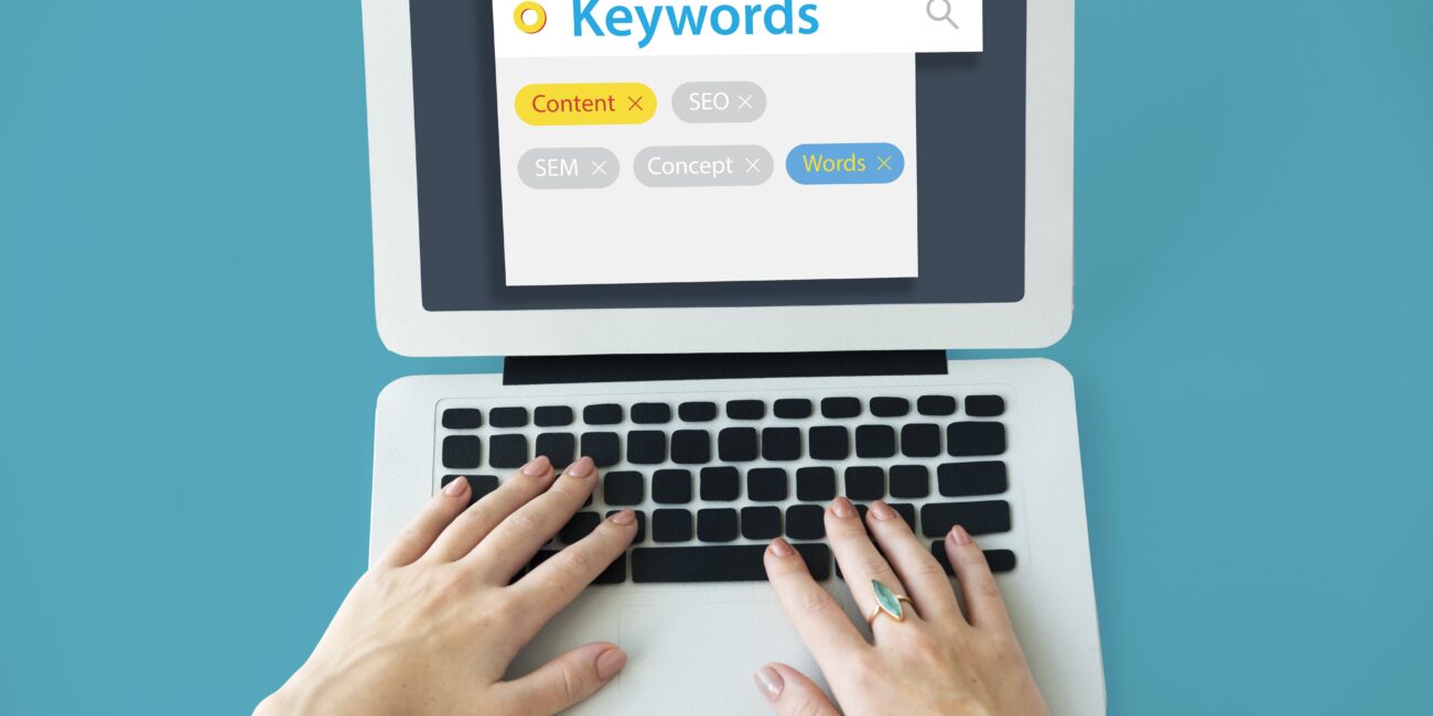 keyword research for beginners on laptop with SEO analytics dashboard open