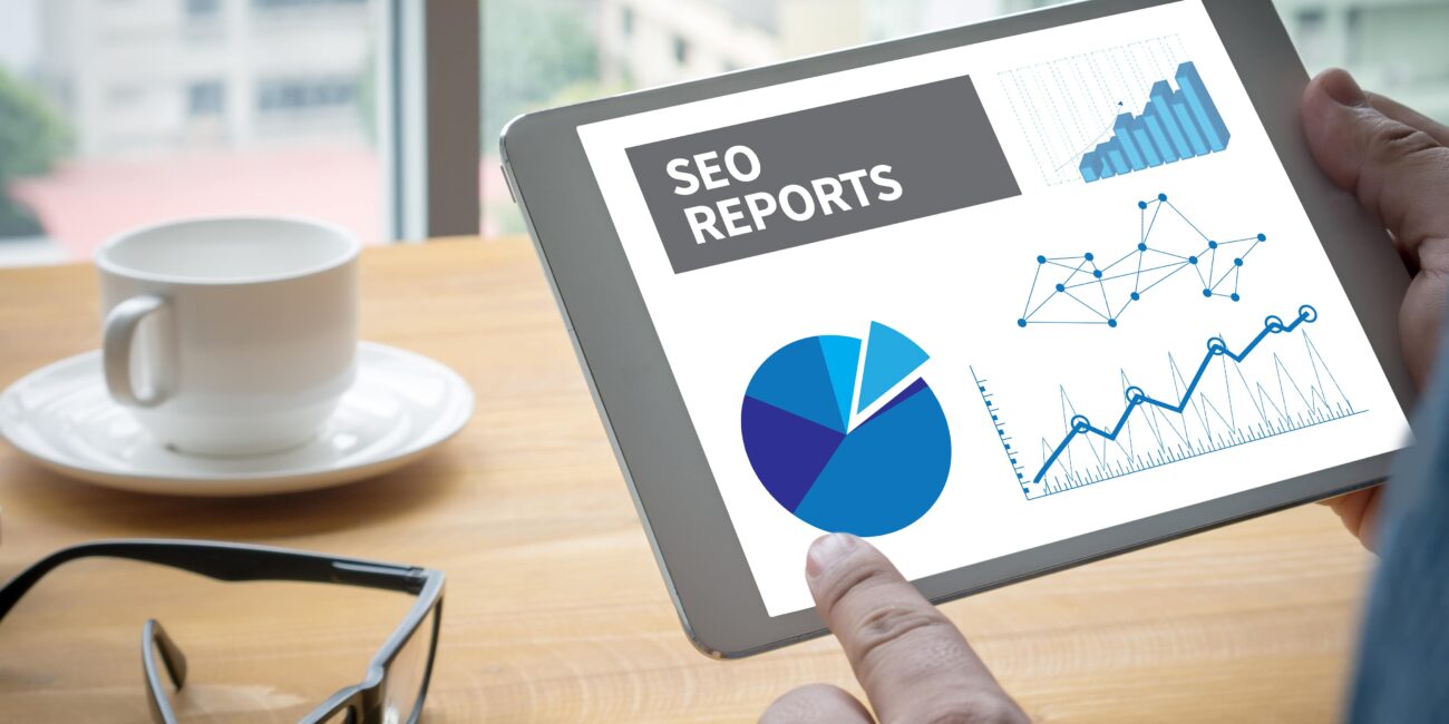 small business owner analyzing SEO performance dashboard on laptop