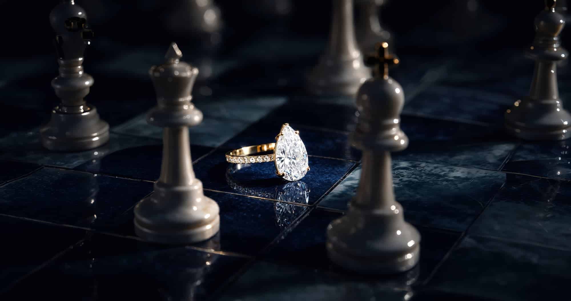 Doenara: a pear-shaped diamond ring on a chessboard, between the king and the queen