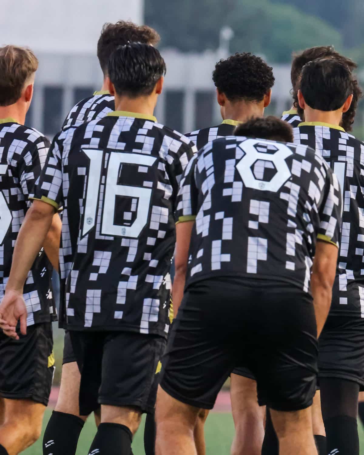 LA Sol Athletics players seen from behind in the club&rsquo;s black and white patterned shirts
